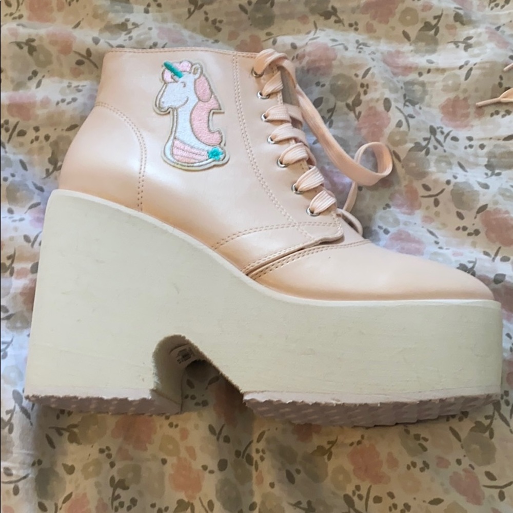 Size 9 unicorn platform sneakers. Never worn.
